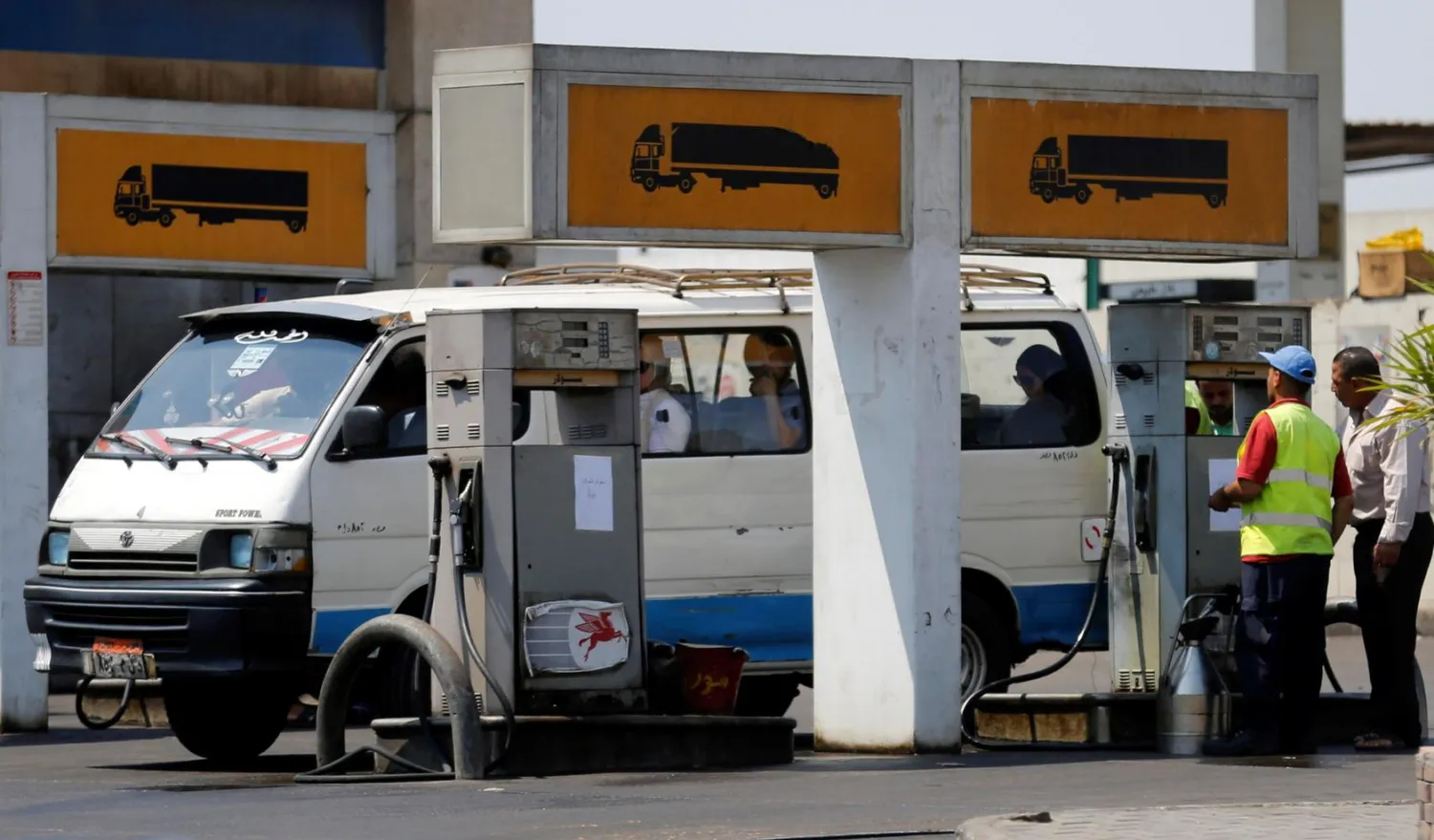 A microbus is filled up with fuel by an employee at a petrol station in Cairo, Egypt. REUTERS/Amr Abdallah Dalsh