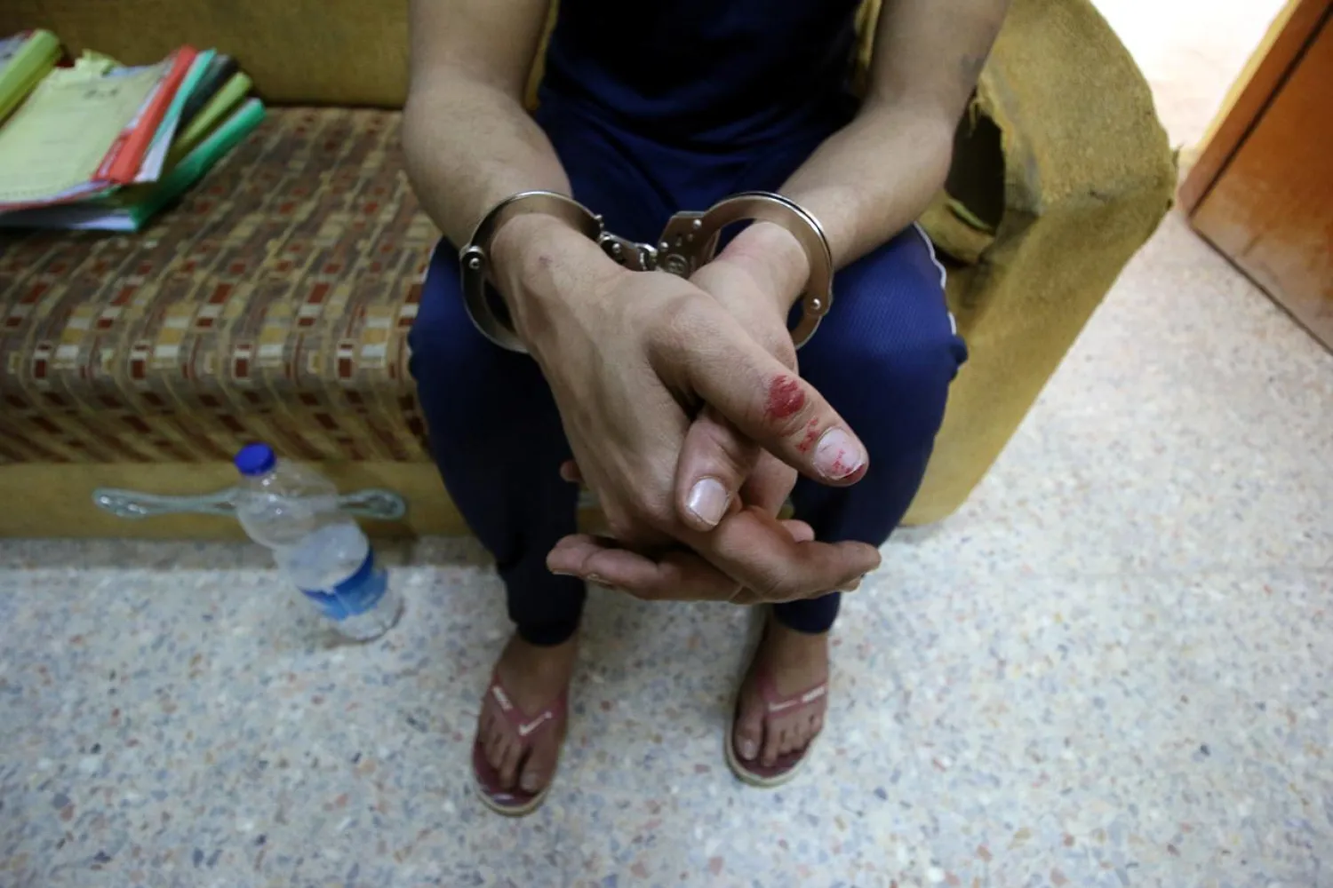 An Iraqi suspect, who was arrested for drug-related crimes, is seen at a police station in Basra, Iraq February 25, 2019. (Reuters)