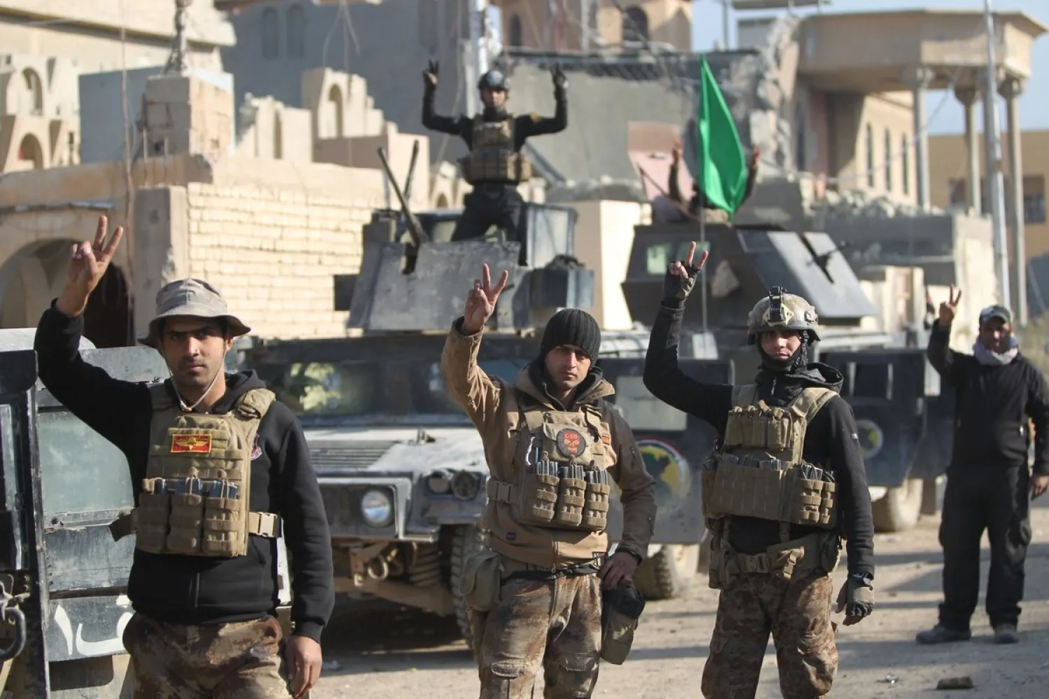 Members of Iraq's elite counter-terrorism service gather on December 29, 2015 in the city of Ramadi, the capital of Iraq's Anbar province, about 110 kilometers west of Baghdad, after Iraqi forces recaptured it from ISIS. AHMAD AL-RUBAYE / AFP