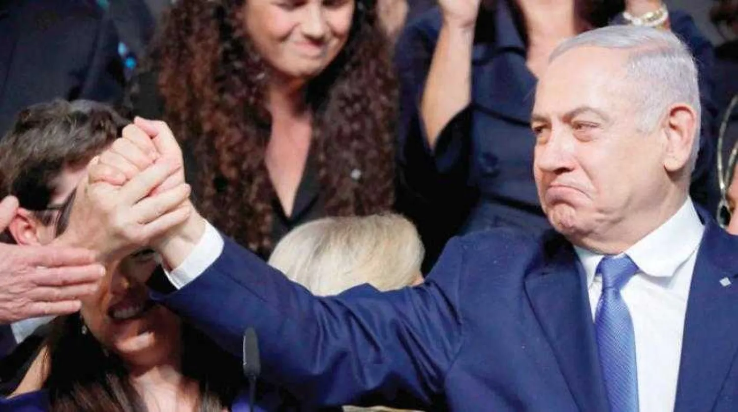 Israeli PM Benjamin Netanyahu salutes supporters from his Likud Party in Tel Aviv on Wednesday, April 10, 2019. (AFP)
