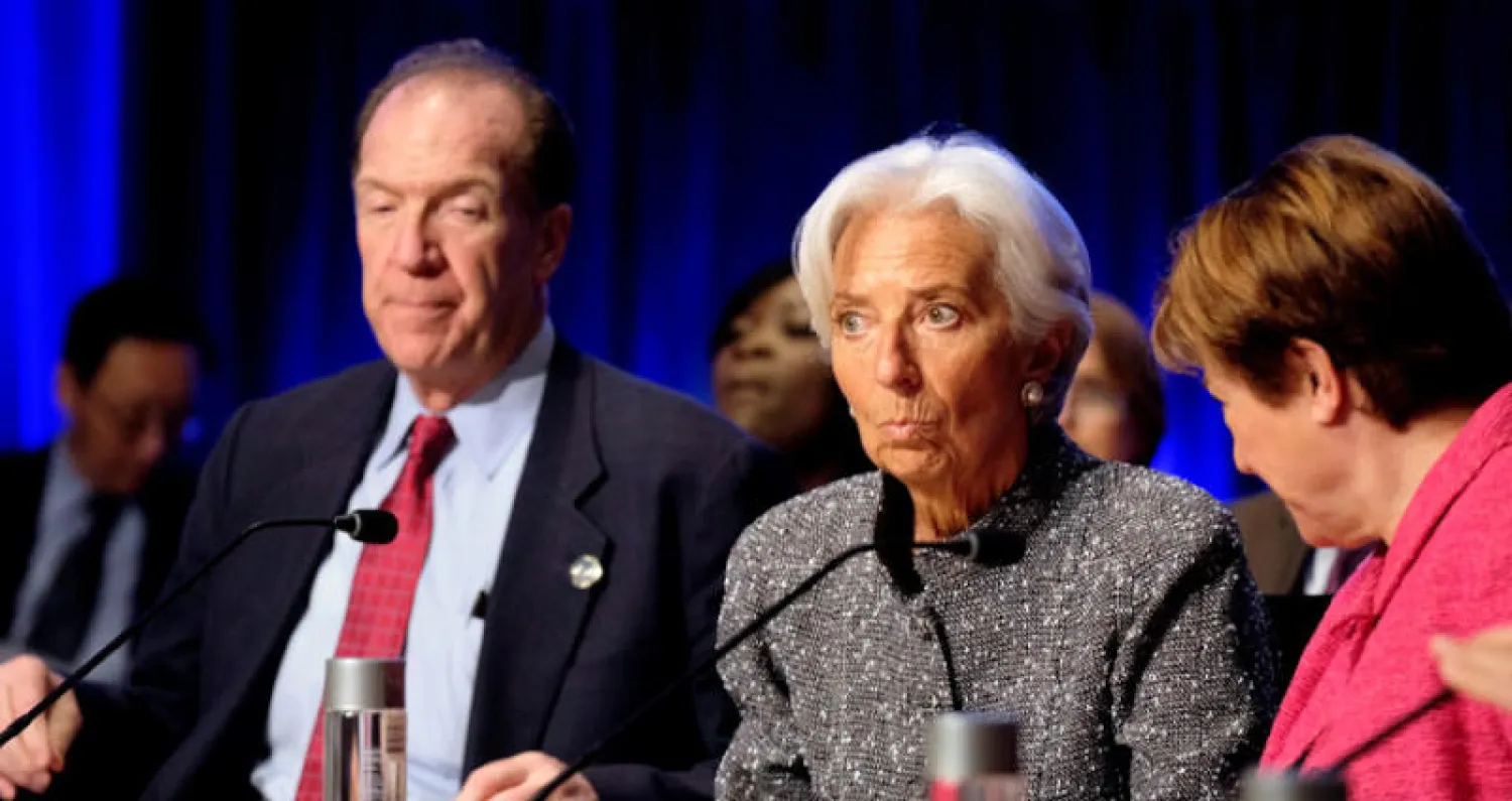 رئيسا صندوق النقد والبنك الدوليين كريستين لاغار وديفيد مالباس في اجتماعات الربيع للمؤسستين في واشنطن أول من أمس (رويترز)