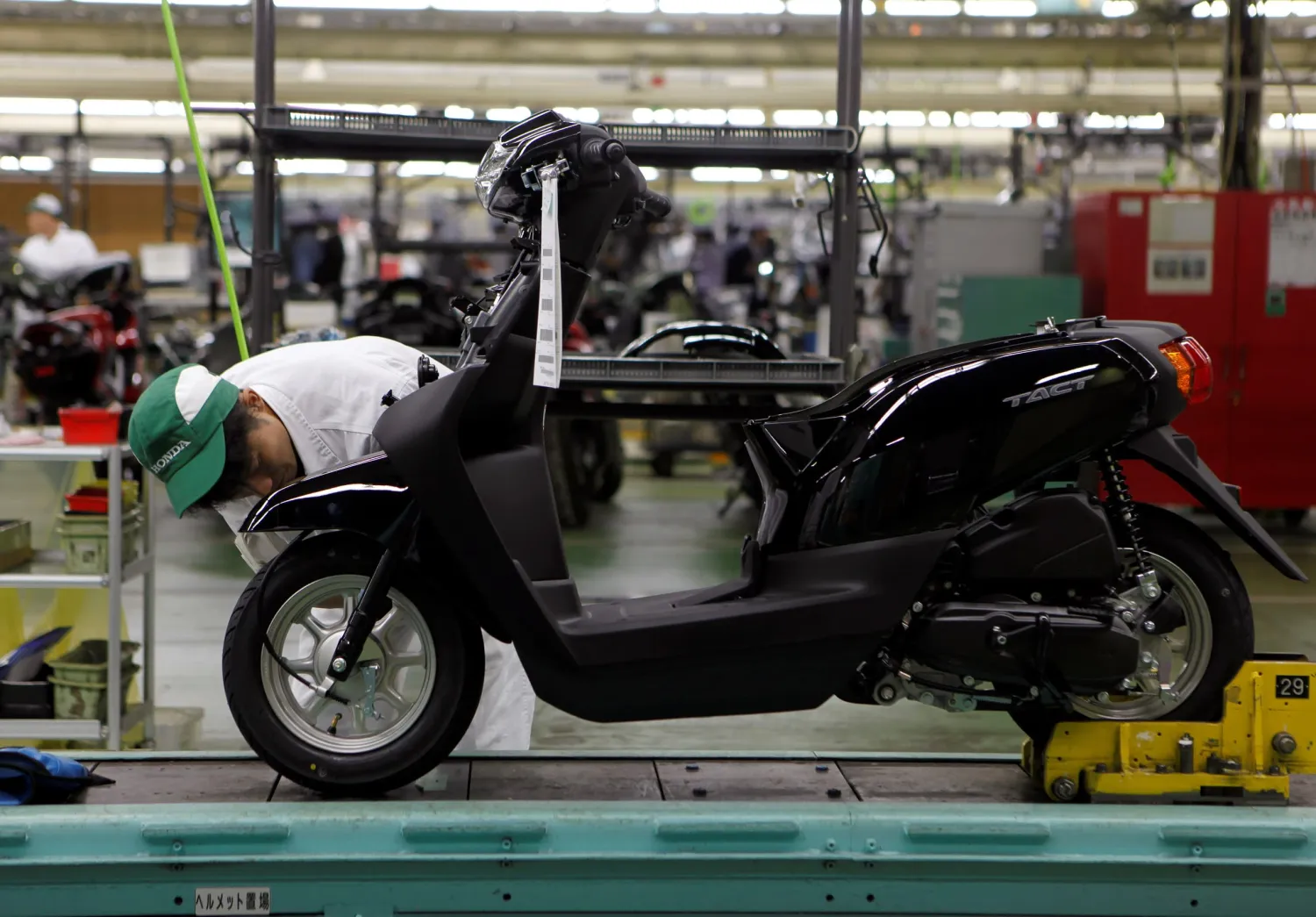 A worker is seen at an assembly line of motorcycles at Honda
Motor's Kumamoto factory in Kumamoto, Japan.   © Reuters