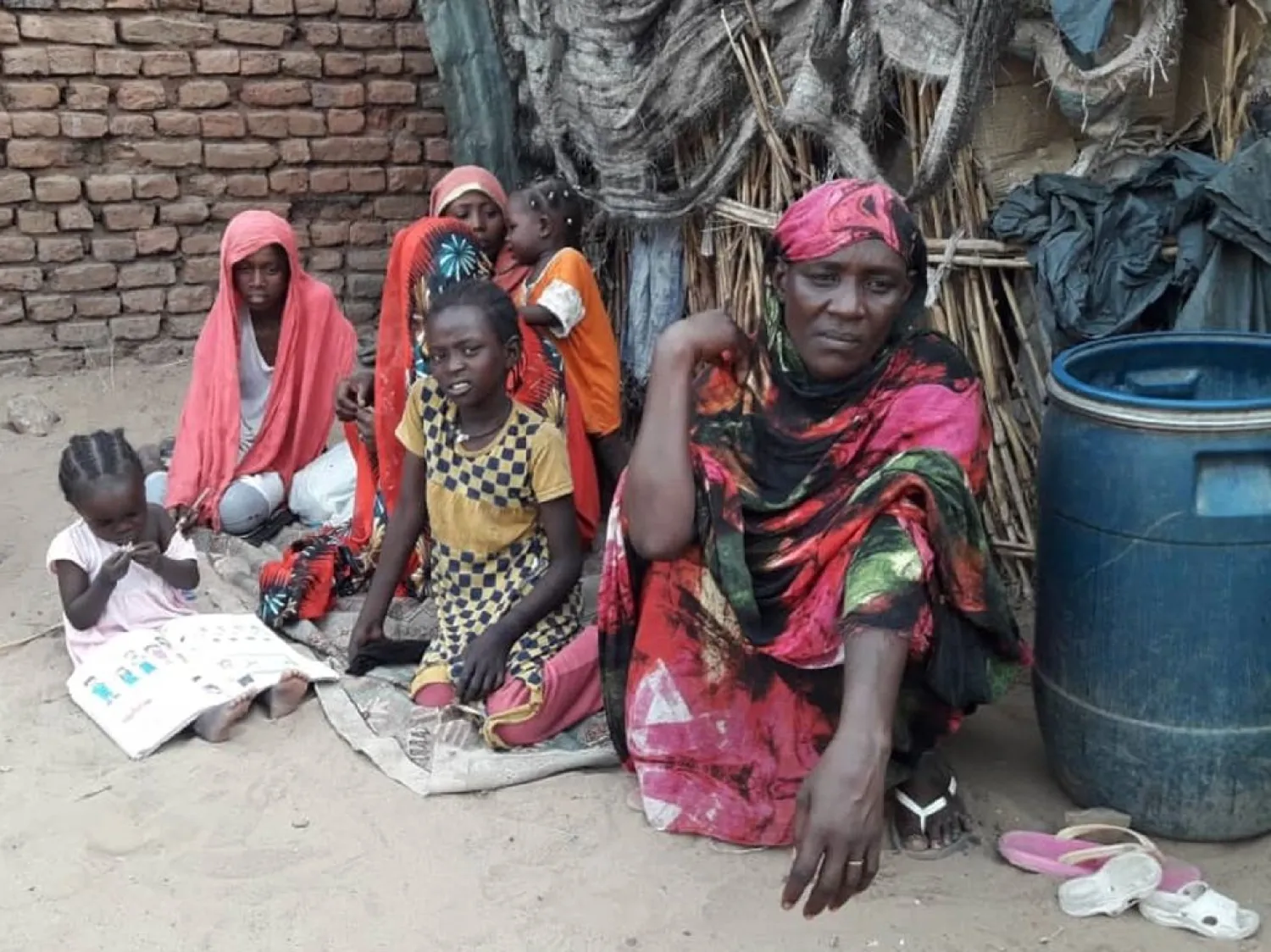 Ayesha Mohamed Hamid (R), 50, a Sudanese woman, is pictured in Al-Salam camp outside South Darfur state capital Nyala, on April 18, 2019. AFP