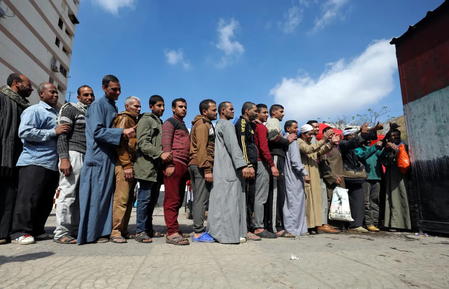 Egyptians queue to cast their vote in a referendum on constitutional amendments. (Reuters)