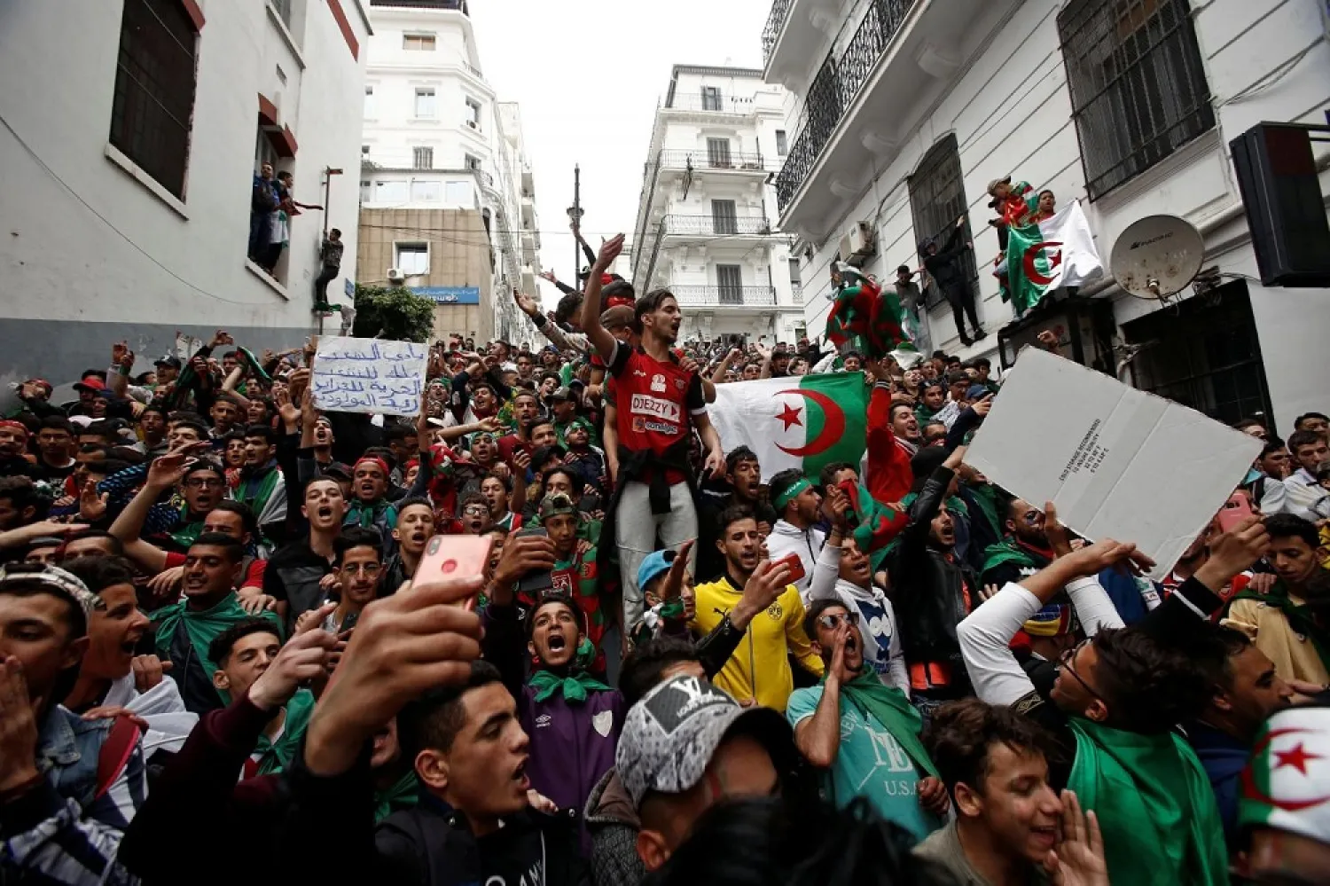 Protesters rally to demand a complete change in Algeria's political class. (Reuters)