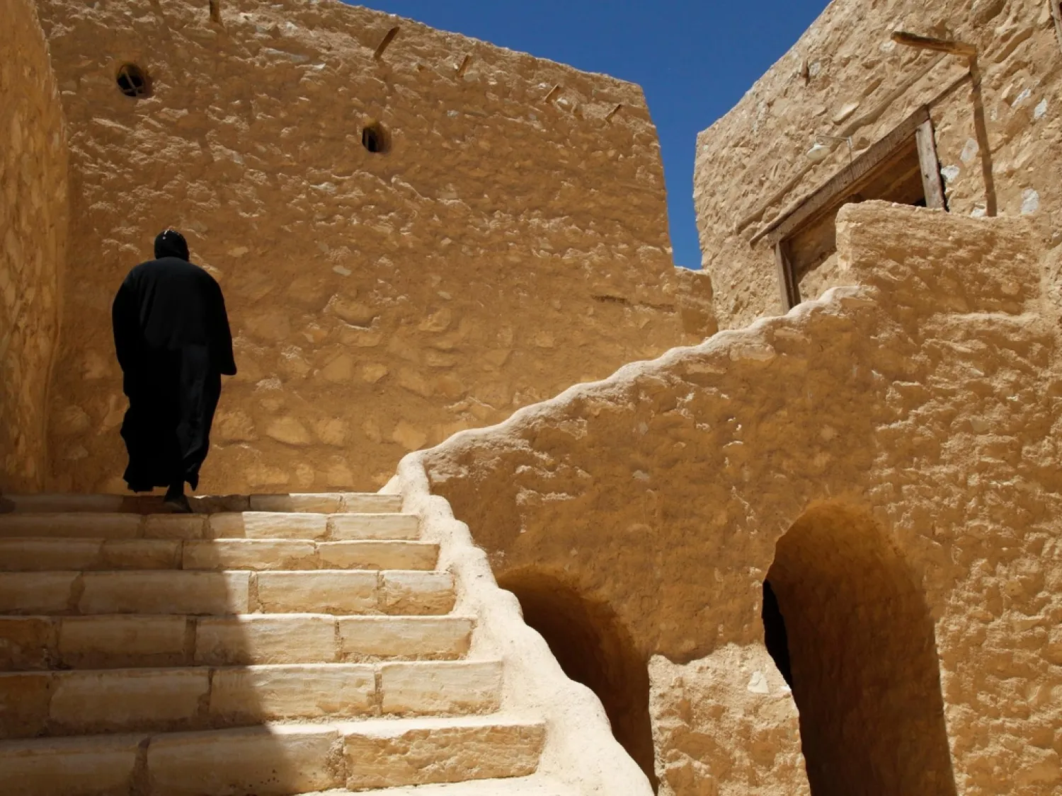 A monk walks on the grounds of the ancient monastery of St. Anthony, southeast of Cairo, Egypt. (AP)