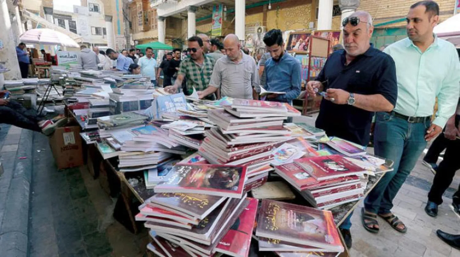 Iraqis at Baghdad's prominent bookselling al-Mutanabbi street, EPA

