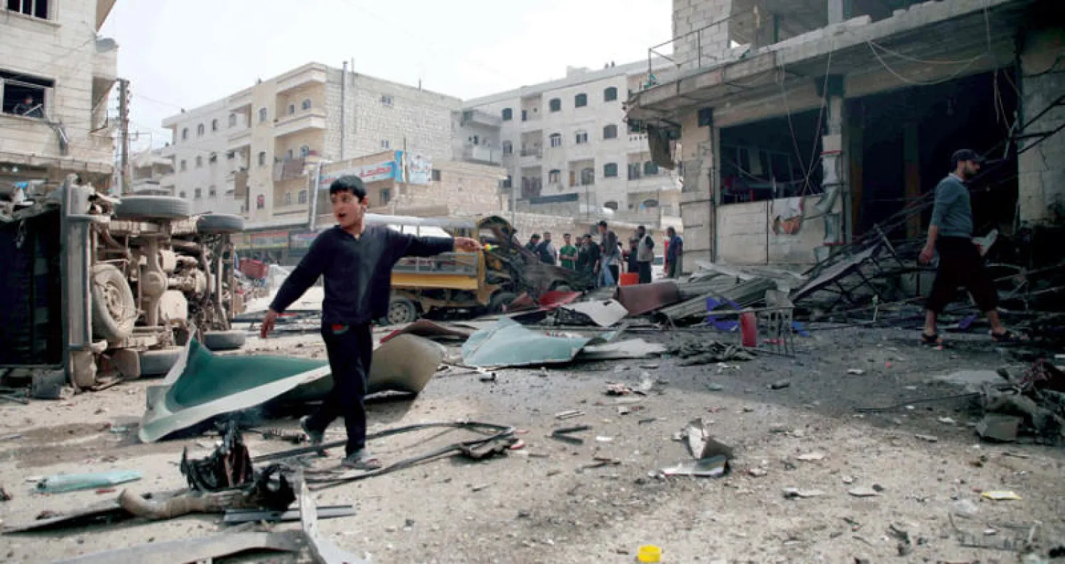 بعد تفجير في الدانا في ريف ادلب شمال سوريا أمس (أ.ف.ب)