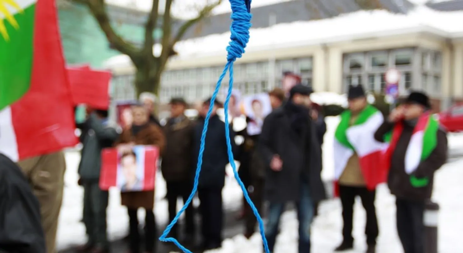 Iranian exiles shout slogans in front of a mock gallows to protest against executions in Iran during a demonstration outside the Iranian embassy in Brussels, Dec. 29, 2010. (Reuters)