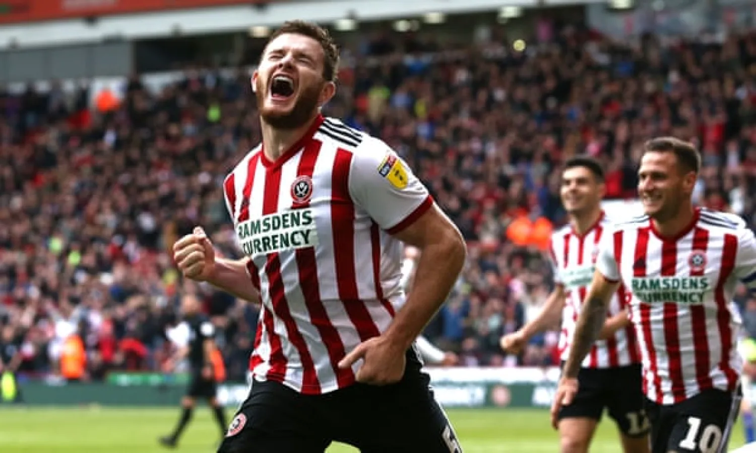  Jack O’Connell celebrates after scoring Sheffield United’s second goal in their 2-0 win over Ipswich. That result and Leeds’s draw with Aston Villa ensured promotion. Photograph: Jan Kruger/Getty Images
