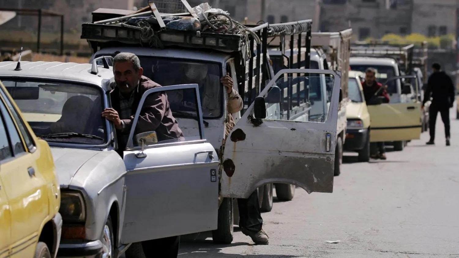 Drivers wait to fill their cars with fuel rations in Aleppo, Syria. (Reuters)