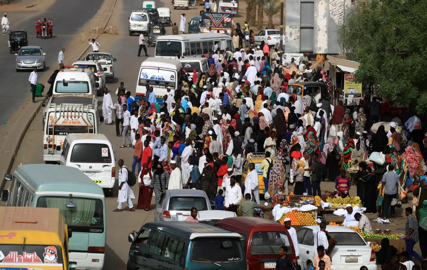 Sudanese residents wait for buses on a street in Khartoum, Sudan, May 4, 2019. (Reuters)