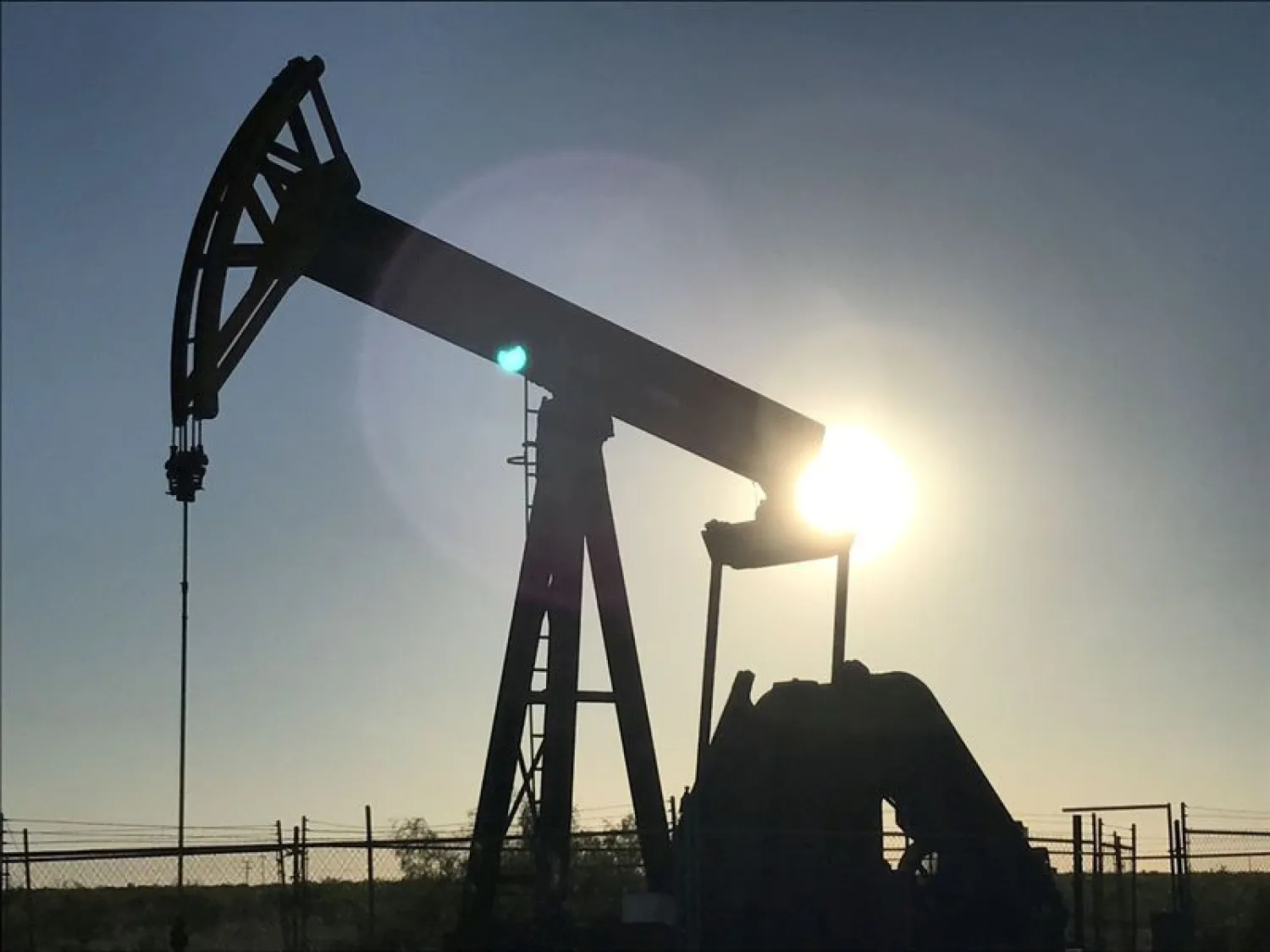 FILE PHOTO: An oil pump jack is seen at sunset near Midland, Texas, US, May 3, 2017. REUTERS/Ernest Scheyder/File Photo