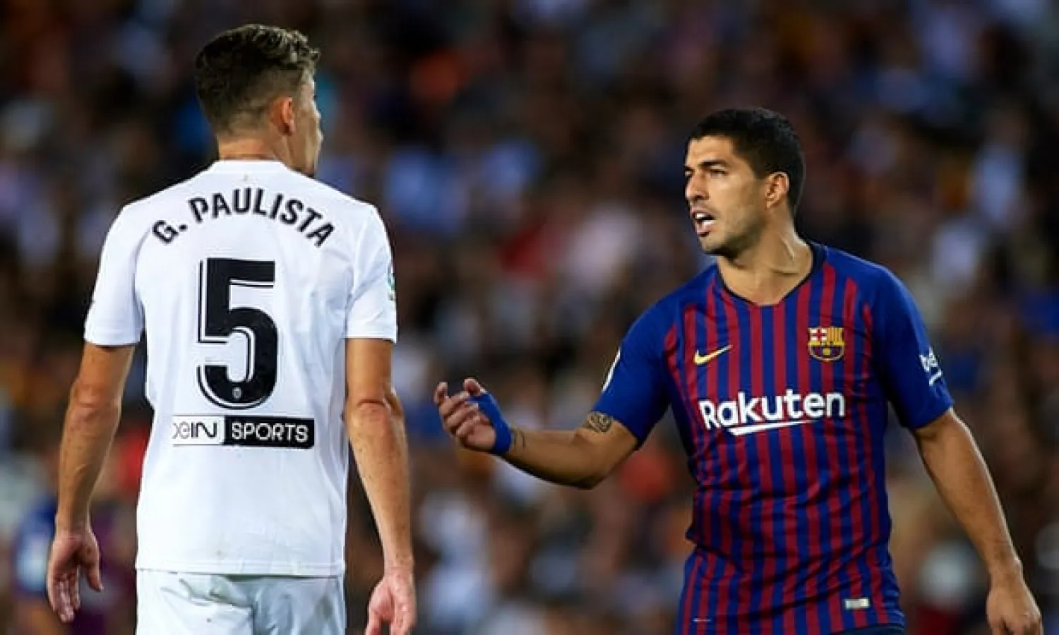  Gabriel Paulista argues with Luis Suárez during a La Liga game. ‘Suárez talks to you all the time because he wants to put you off. But at the end, he’ll give you a hug’ Photograph: Manuel Queimadelos Alonso/Getty Images
