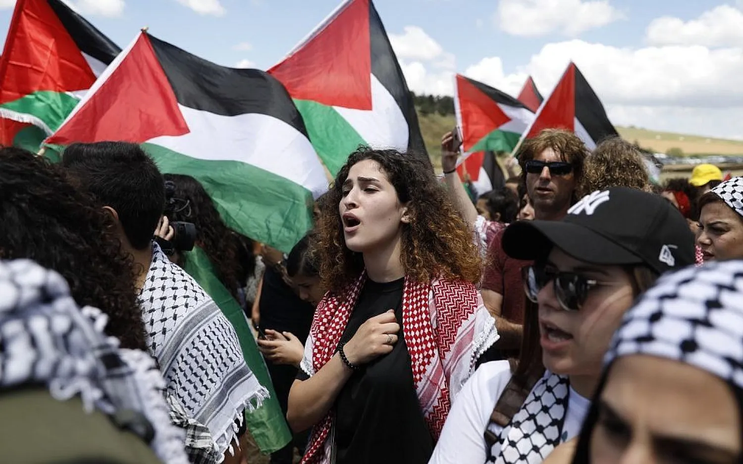 Arab Israelis wave Palestinian flags as they take part in the annual March of Return near the northern city of Umm al-Fahm, on May 9, 2019. (AFP)