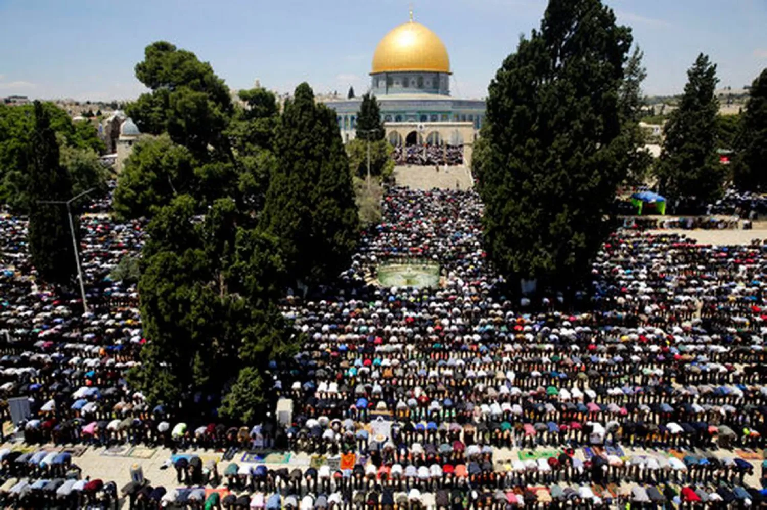 Palestinians pray in front of the Dome of the Rock shrine during a holy month of Ramadan, in Jerusalem, Friday, May 10, 2019. (AP Photo/Mahmoud Illean)