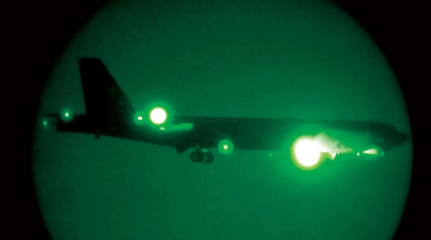 In this May 9, 2019 image released by the US Air Force, a US B-52H Stratofortress, seen through night vision equipment, assigned to the 20th Expeditionary Bomb Squadron comes in for a landing at Al Udaid Air Base, Qatar, May 9, 2019. Ashley Gardner / US AIR FORCE / AFP