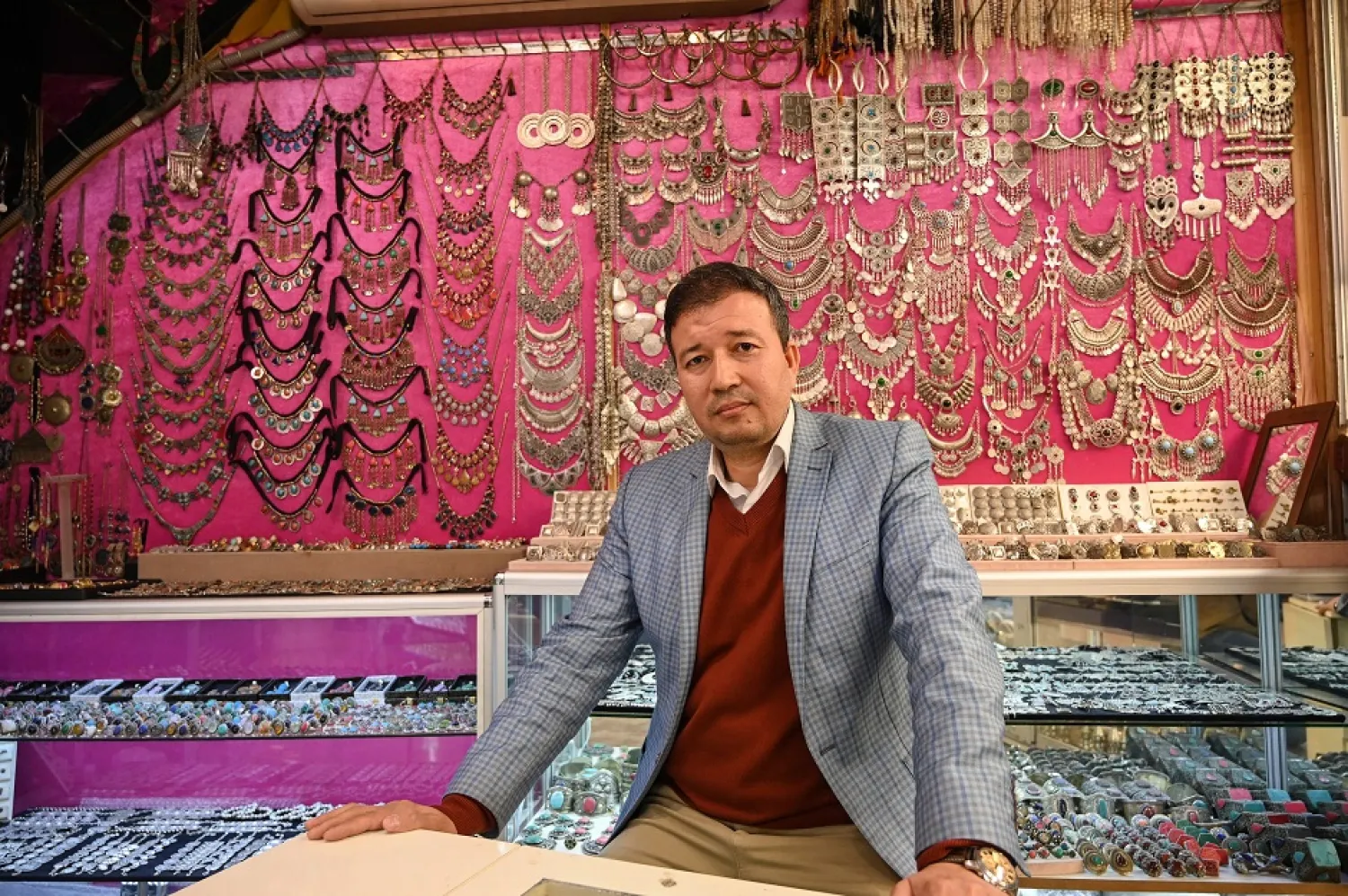 Expert Afghan jeweler Khalil Nuri poses for a picture in his shop, in the Grand Bazaar in Istanbul. (AFP)