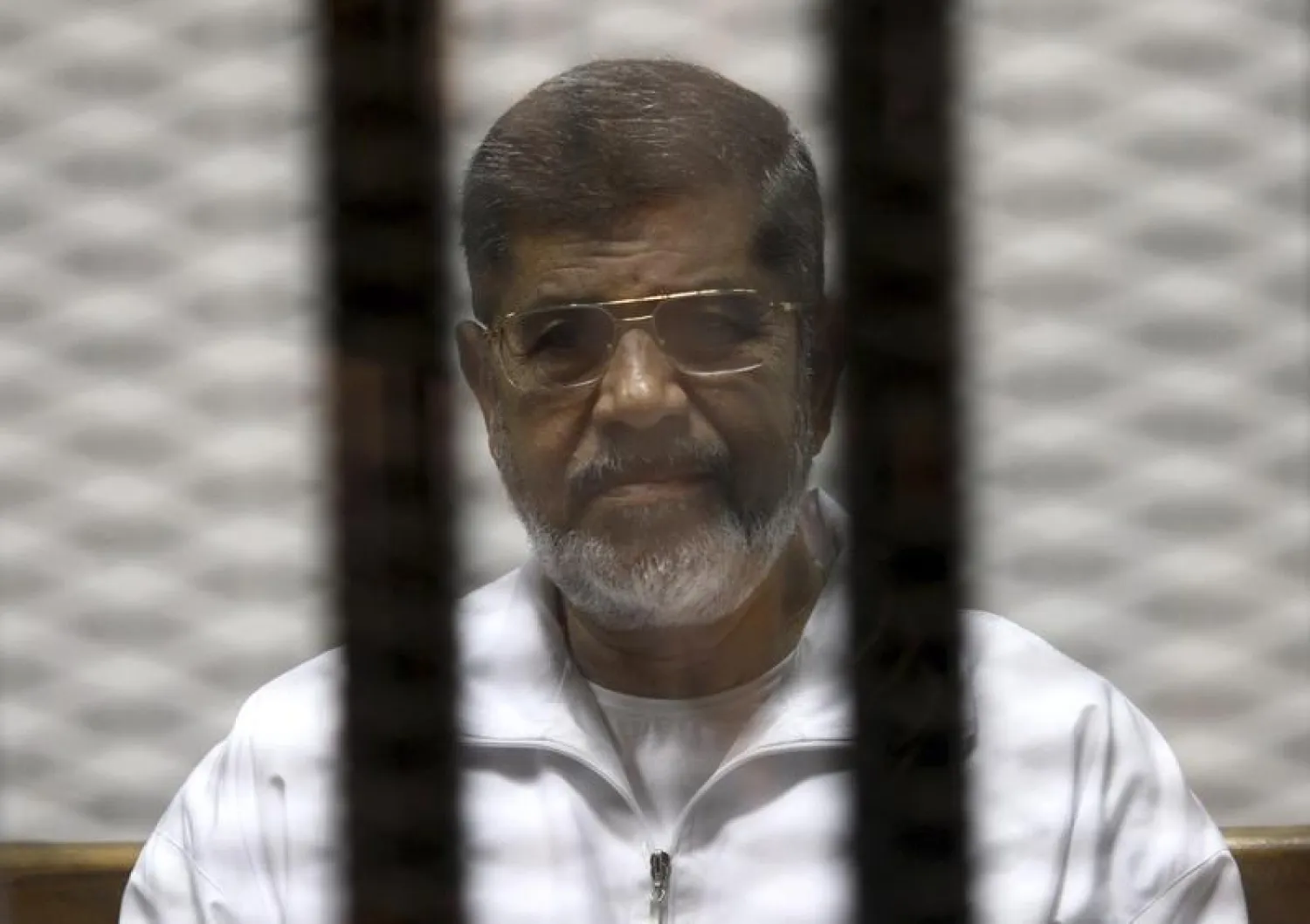 Ousted Egyptian president Mohamed Morsi is seen behind bars during his trial at a court in Cairo. (Reuters file photo)