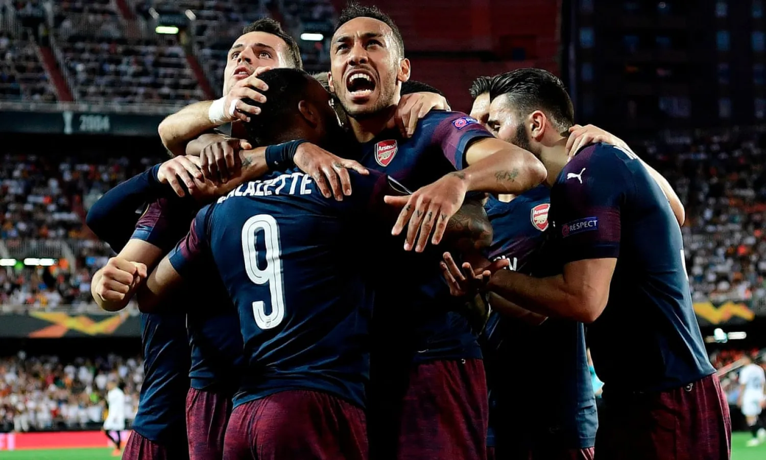Pierre-Emerick Aubameyang (center), who scored a hat-trick during the 4-2 win at Valencia in the semi-final, leads Arsenal’s celebrations. Photograph: Javier Soriano/AFP/Getty Images
