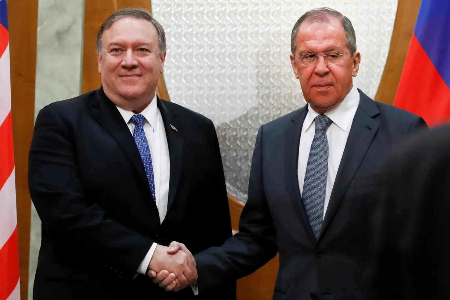 Mike Pompeo and Sergey Lavrov shake hands after their joint news conference © Reuters / Pavel Golovkin 