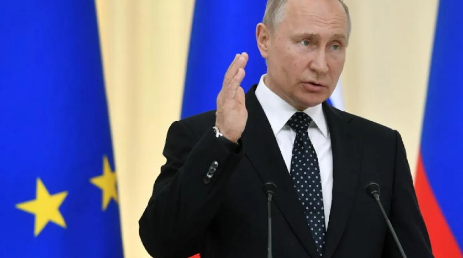 Rusya Devlet Başkanı Vladimir Putin bir basın toplantısındayken (EPA-Arşiv)