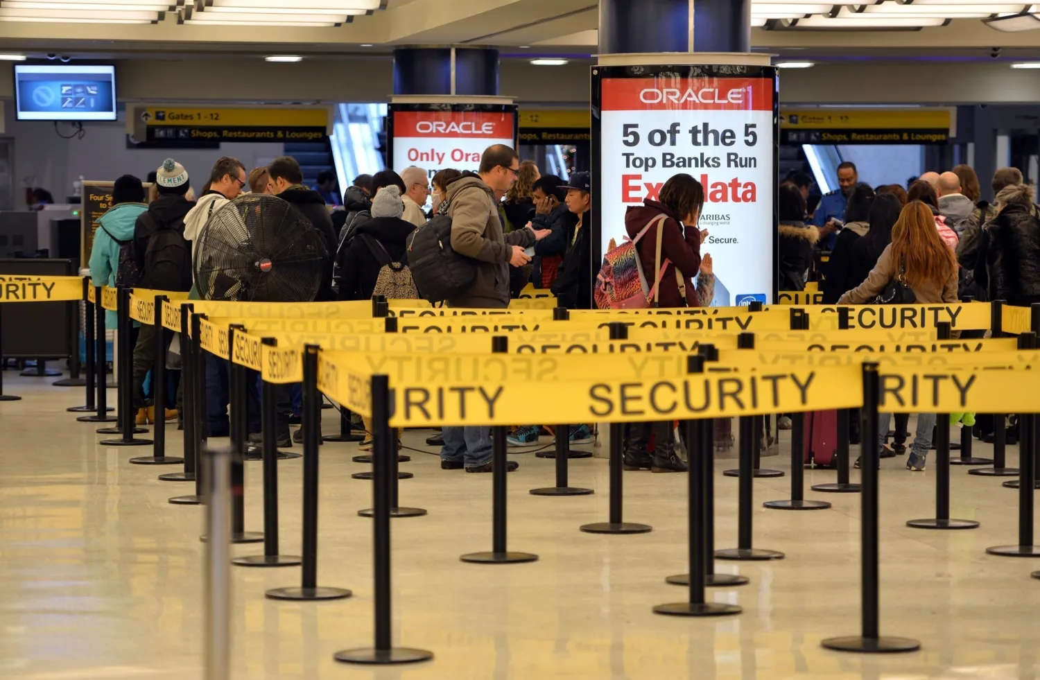 This Jan. 6, 2014, file photo shows people in security lines at Kennedy International Airport in New York. (Stan Honda, AFP)