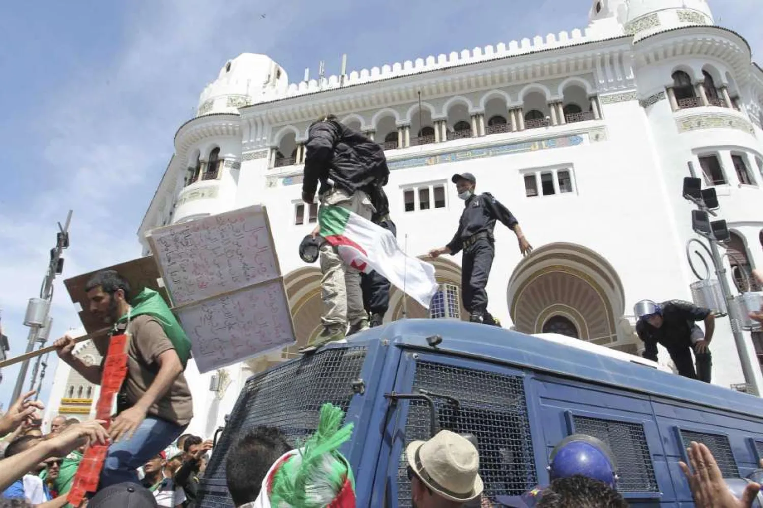 Algerian protesters gather during an anti-government demonstration outside La Grande Poste (main post office) in the center of the capital Algiers, Friday, May 17, 2019. (AP Photo/Fateh Guidoum)