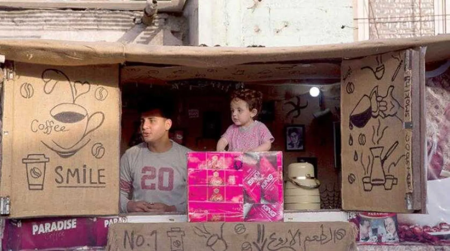 A Palestinian youth and child at a beach kiosk in Gaza City, Monday, May 20, 2019. (AP Photo/Hatem Moussa)