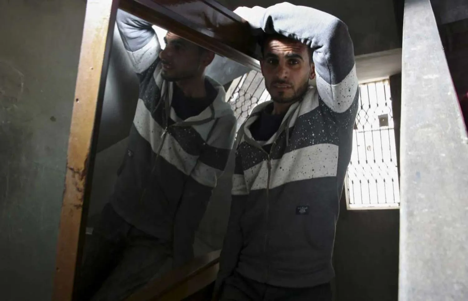 In this April 21, 2019 photo, Palestinian groom Yehiya Taleb, moves a mirror, part of his wedding furniture, to his apartment in Shati refugee camp, Gaza City. (AP)