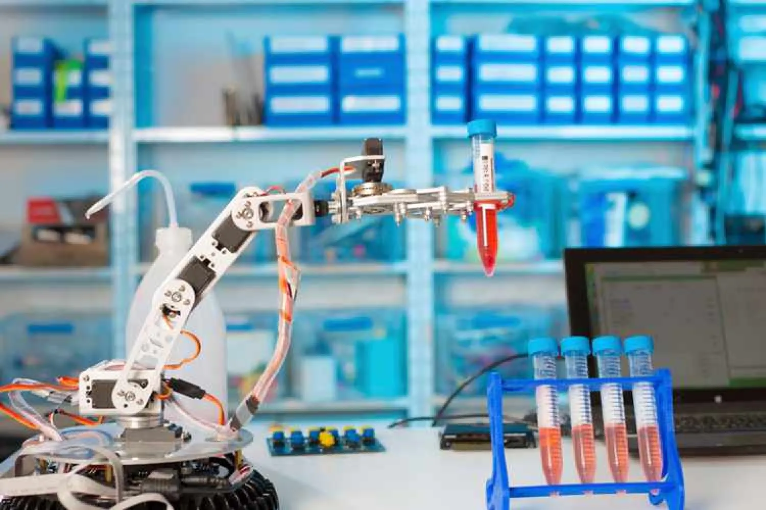 Robotic arm holding test tube in the laboratory. Image used for illustrative purpose. - Getty Images