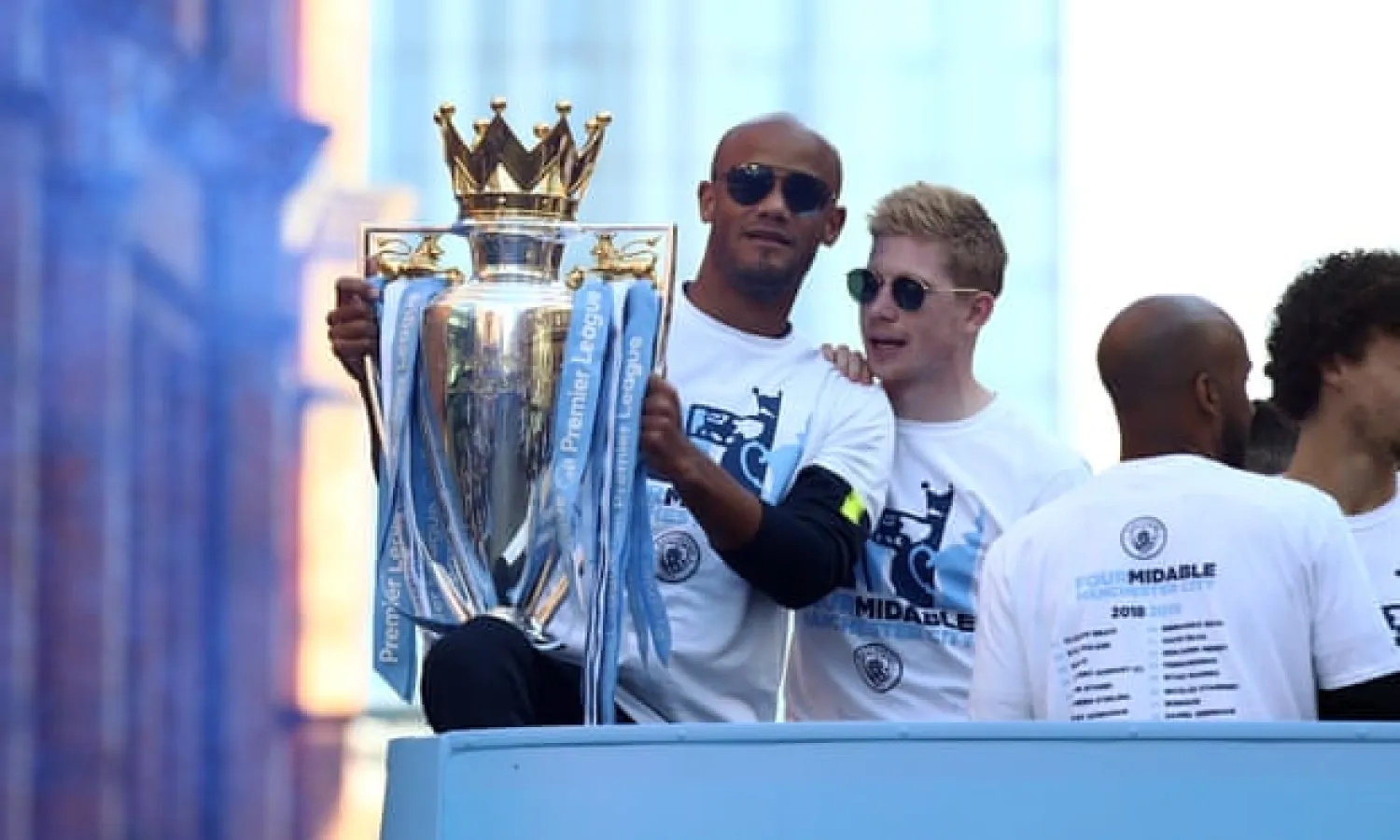 Vincent Kompany shows off the Premier League trophy during Manchester City’s parade. The mood at Anderlecht was very different until his return was announced. Photograph: Manchester City FC/Man City via Getty Images
