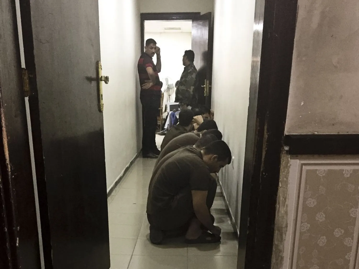  in this May 23, 2018 file photo, suspected ISIS militants wait their turn for sentencing at the counterterrorism court in Baghdad, Iraq. (AP Photo/Maya Alleruzzo, File)