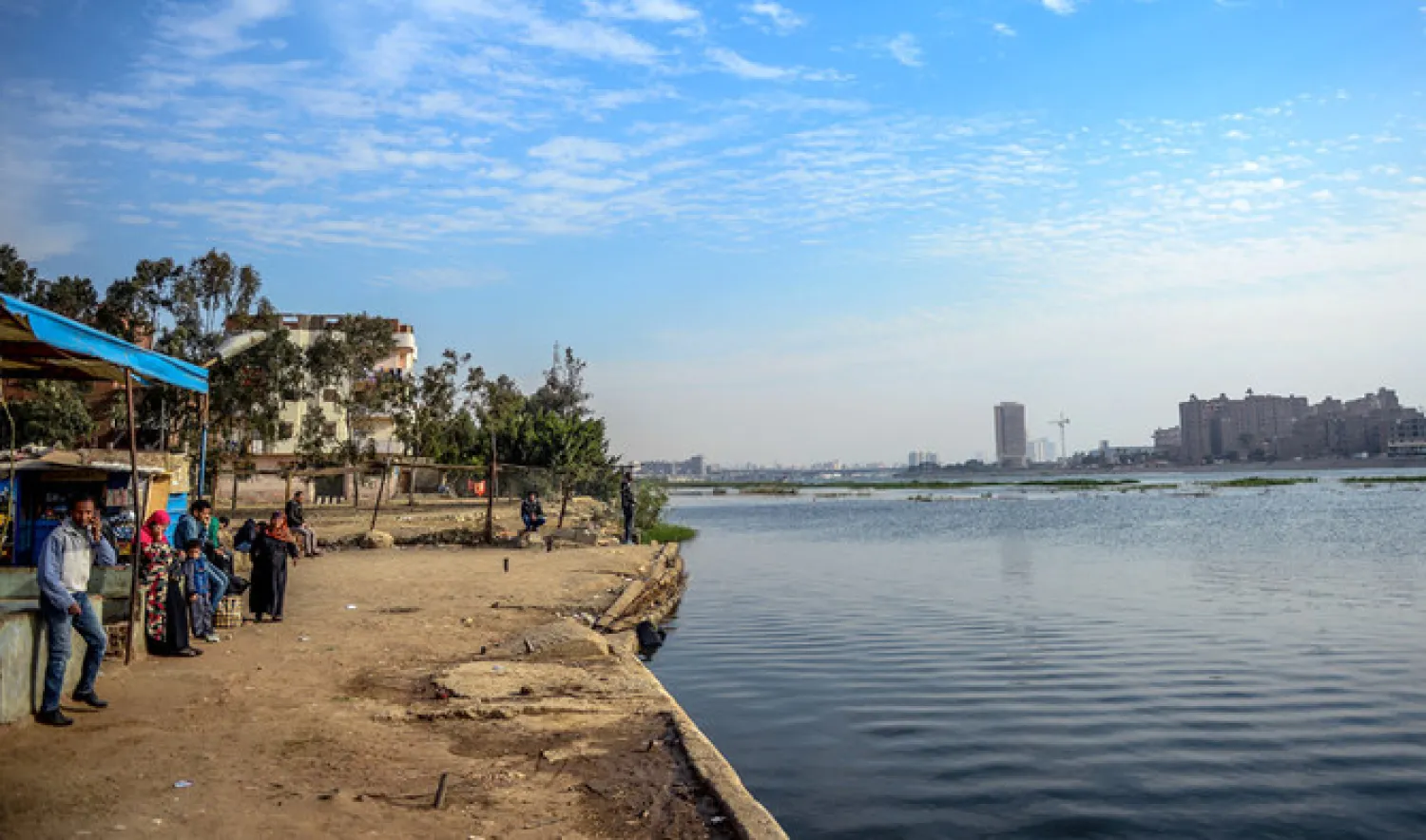Egyptians wait for a ferry to cross the Nile river in the island of Warraq in the Egyptian capital Cairo on March 12, 2019. (AFP)
