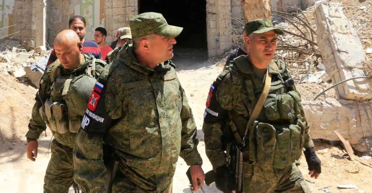 Russian forces patrol damaged buildings in Douma on the outskirts of Damascus. AFP file photo