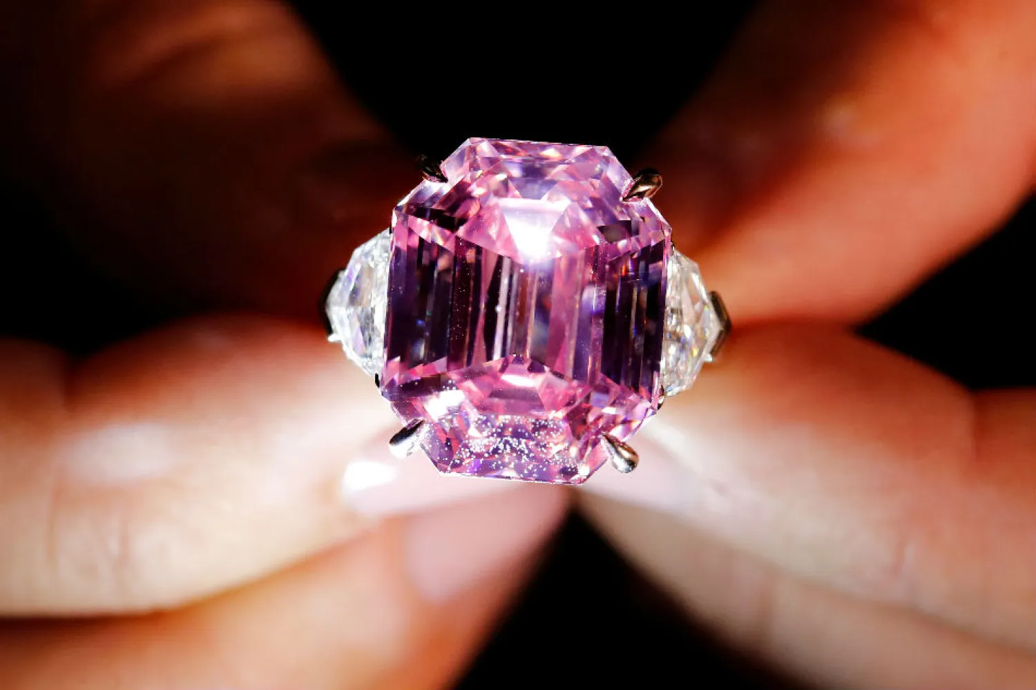 A Christie's staff holds a 18.96 carat Fancy Vivid Pink Diamond during a preview in Geneva, November 8, 2018. Denis Balibouse, Reuters