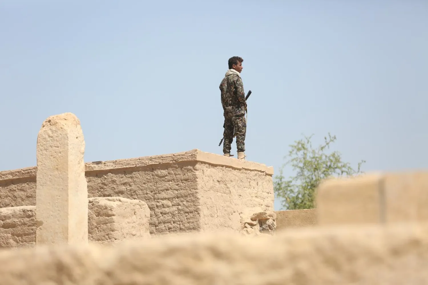 A pro-government soldier stands guard at a historical site in the northern city of Marib, Yemen November 3, 2017. (Reuters)