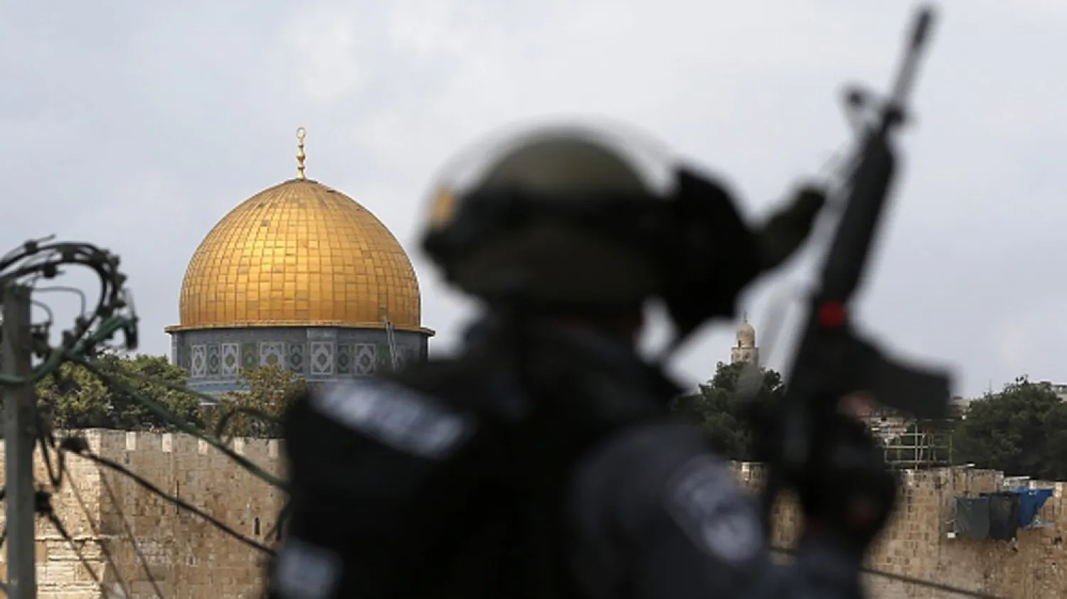 Israeli security forces stand guard as Palestinians take part in Friday prayers in occupied East Jerusalem. (Getty Images file photo)