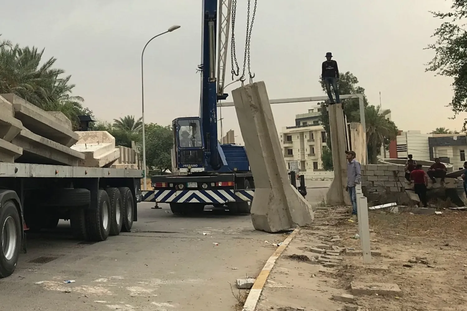Iraqi security forces remove concrete blast walls at the Green Zone in Baghdad. AP file photo
