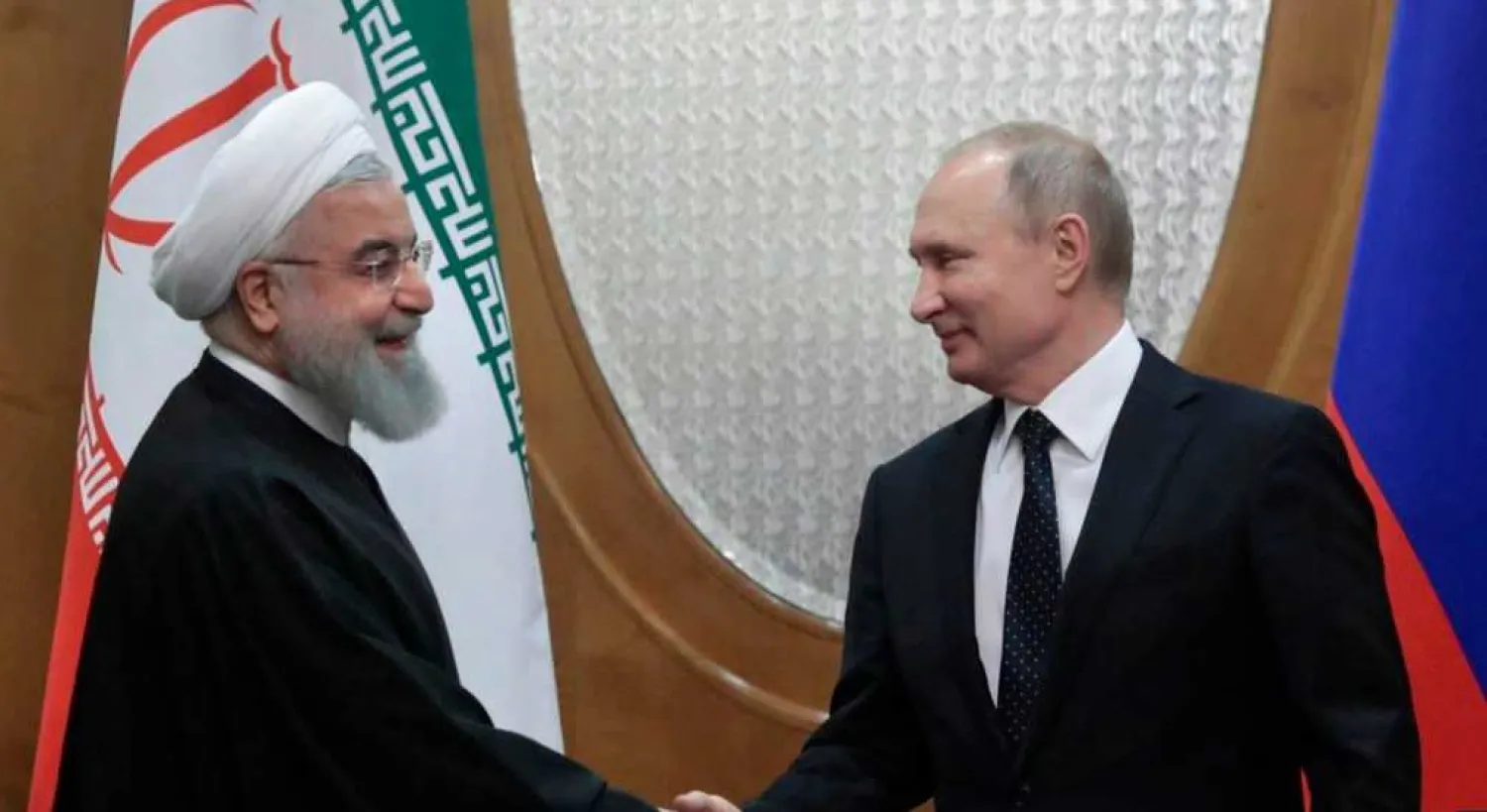 FILE - Russian President Vladimir Putin, right, and Iranian President Hassan Rouhani shake hands prior to the talks in the Bocharov Ruchei residence in the Black Sea resort of Sochi, Russia, Feb. 14, 2019 (AP)