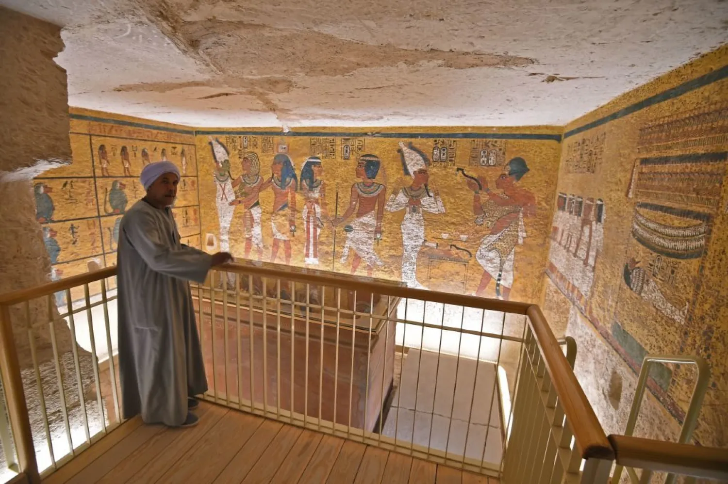 A man stands by the sarcophagus of the 18th-dynasty Pharaoh Tutankhamun, displayed in his burial chamber in his underground tomb in the Valley of the Kings. (Getty Images)