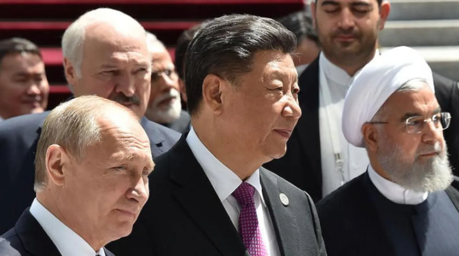 Rusya Devlet Başkanı Vladimir Putin, Çin Devlet Başkanı Şi Cinping ve İran Cumhurbaşkanı Hasan Ruhani, 14 Haziran’da gerçekleşen Şanghay zirvesinde (AFP)
