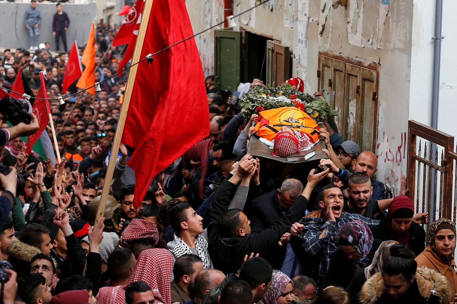 Mourners carry the body of Palestinian volunteer paramedic Sajed Mezher was killed by Israeli troops, during his funeral in Bethlehem in the Israeli-occupied West Bank March 27, 2019. (Reuters)
