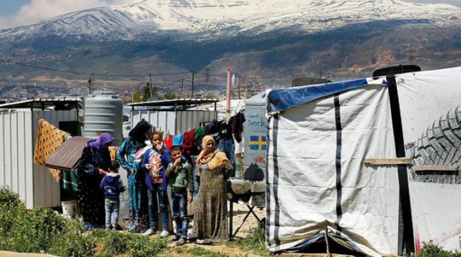 Geçen Nisan ayında Lübnan’ın Bekaa bölgesinde bulunan Saadnayel kasabasında bir okulun açılış töreni sırasında Suriyeli mülteciler (AP)