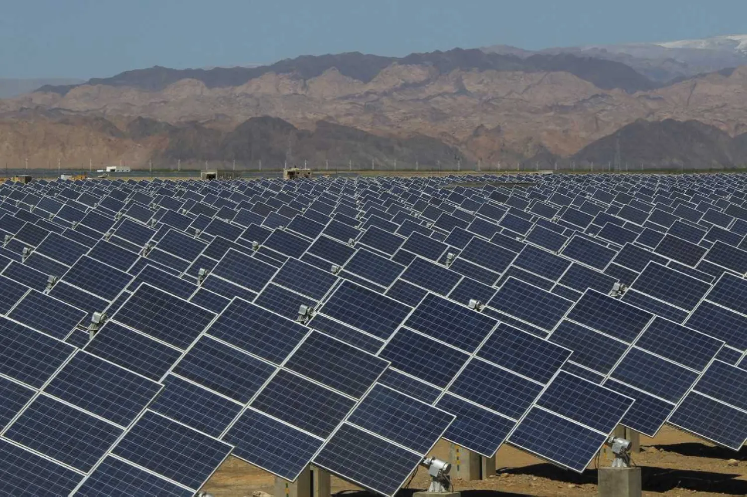 Large solar panels are seen in a solar power plant in Hami, northwest China's Xinjiang Uygur Autonomous Region on May 8, 2013. STR/AFP/Getty Images
