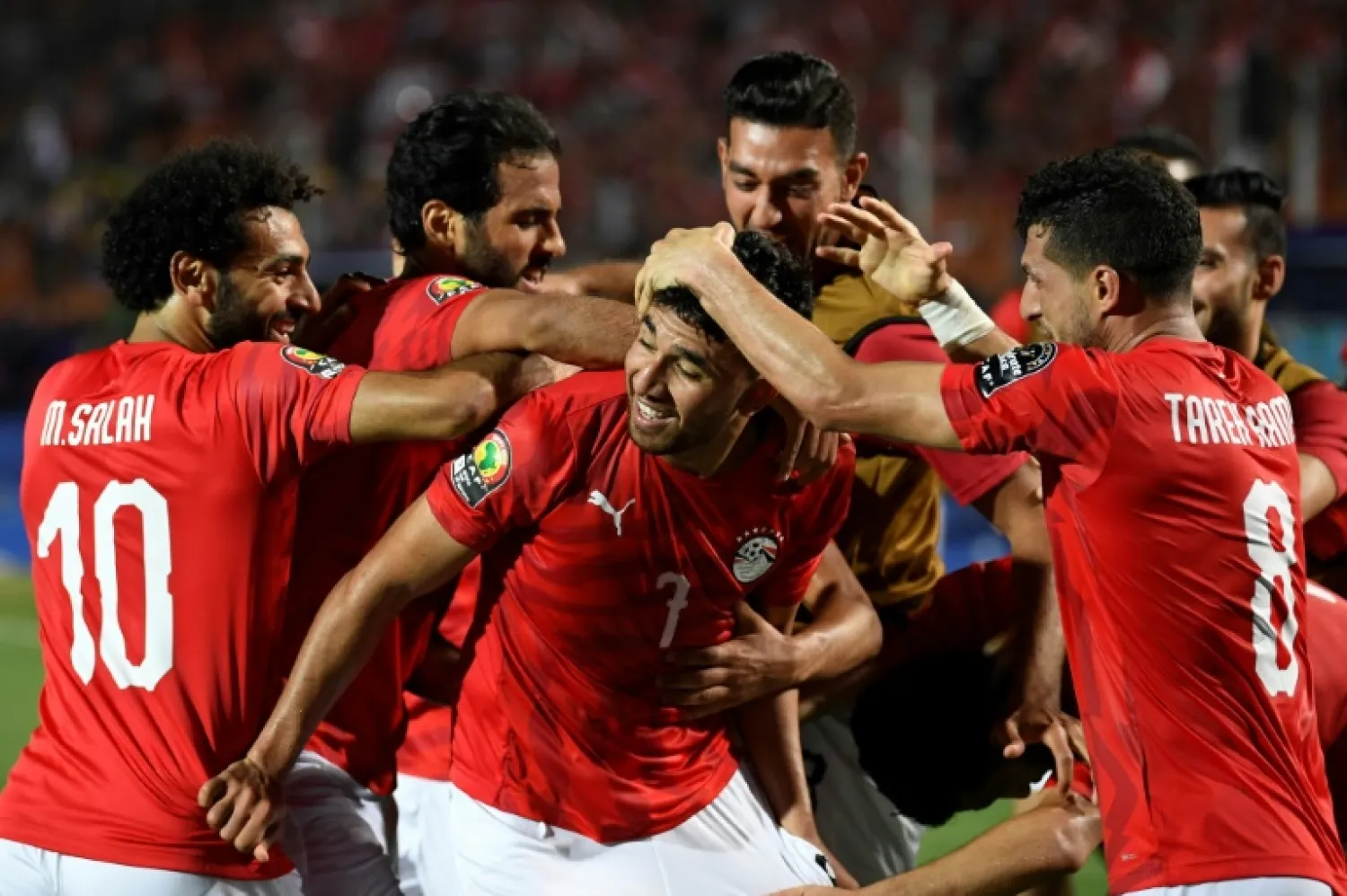 Mahmoud 'Trezeguet' Hassan (C) celebrates scoring the opening goal of the Africa Cup of Nations in Egypt. AFP / Khaled DESOUKI 