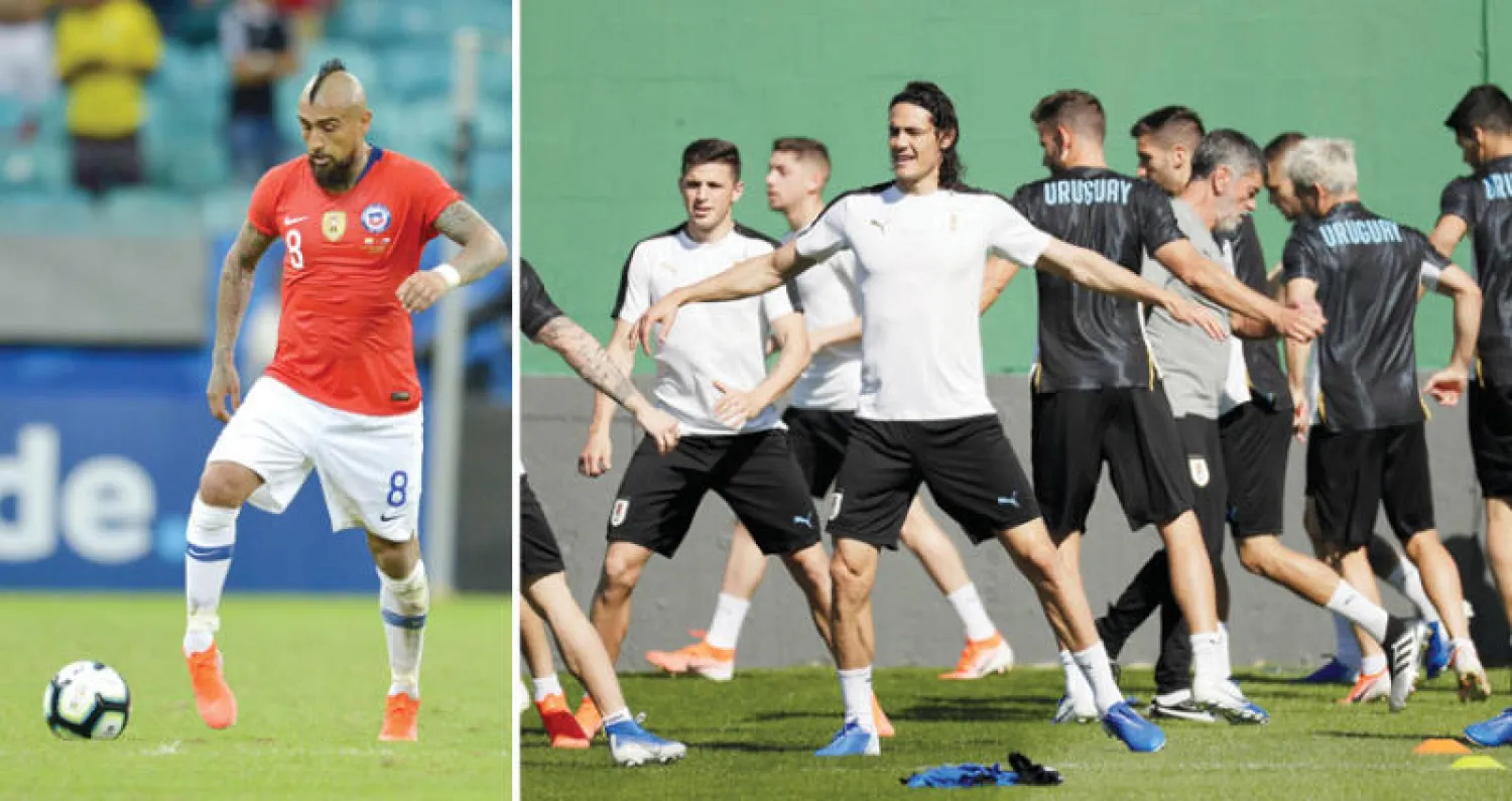 كافاني في تدريبات أوروغواي استعداداً للمواجهة (أ.ب)  -  فيدال أبرز نجوم منتخب تشيلي (أ.ف.ب)