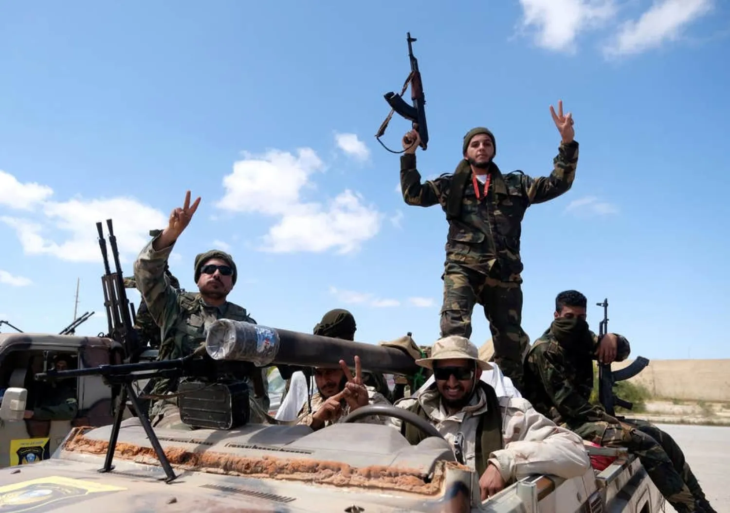 Libyan National Army (LNA) members, commanded by Khalifa Haftar, pose for a picture ( REUTERS )