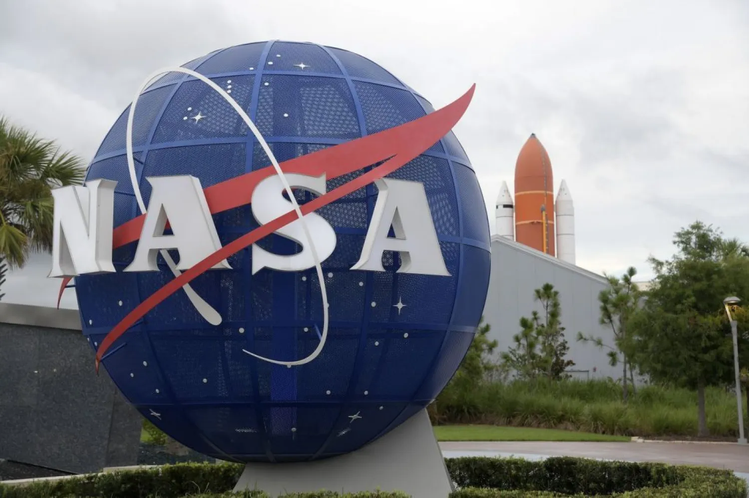 NASA globe stands near the entrance to the Kennedy Space
Center Visitor Complex Sunday, July 29, 2018, in Cape Canaveral, Fla.
(Phelan M. Ebenhack via AP) (Phelan M. Ebenhack / AP)
