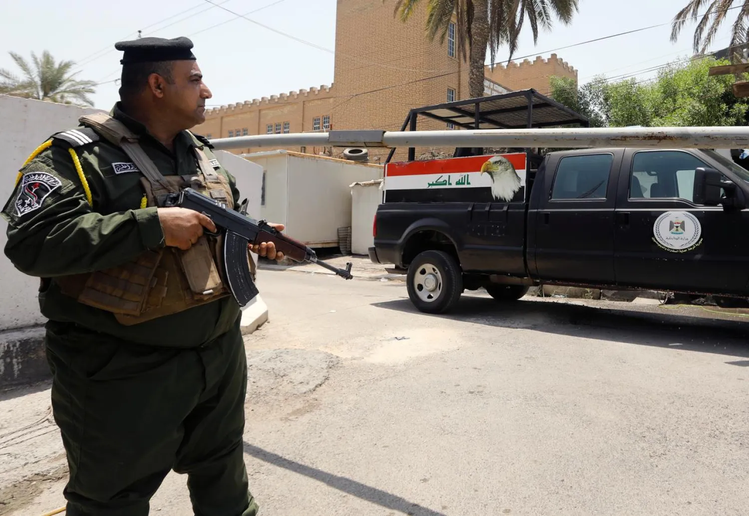 Iraqi security forces stand guard outside the Bahraini embassy in Baghdad, Iraq, June 28, 2019. (Reuters)